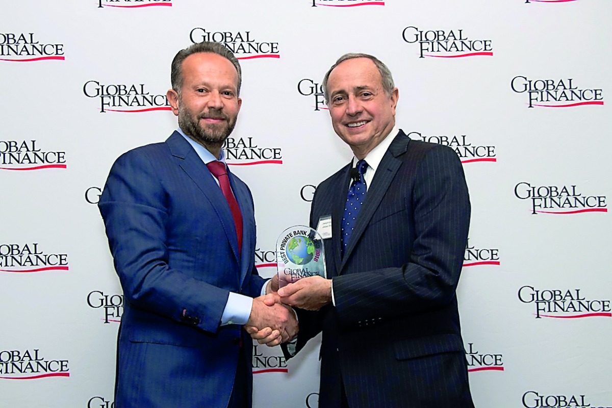 Chaouki Daher (left), General Manager and Head of Private Banking at ibq receiving award from a Global Finance official during a gala event held at ‘The Harvard Club’ in New York City.