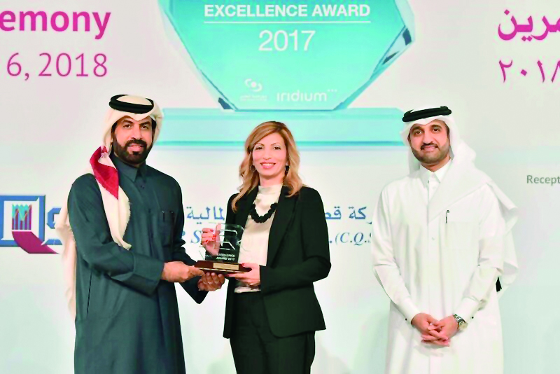 Rashid bin Ali Al Mansoori (left), CEO of QSE giving away the award to an official from Aamal Company, as Abdul Aziz Al Emadi, Director, Listing Department of QSE, looks on, at the 3rd Annual IR Excellence Program, recently.