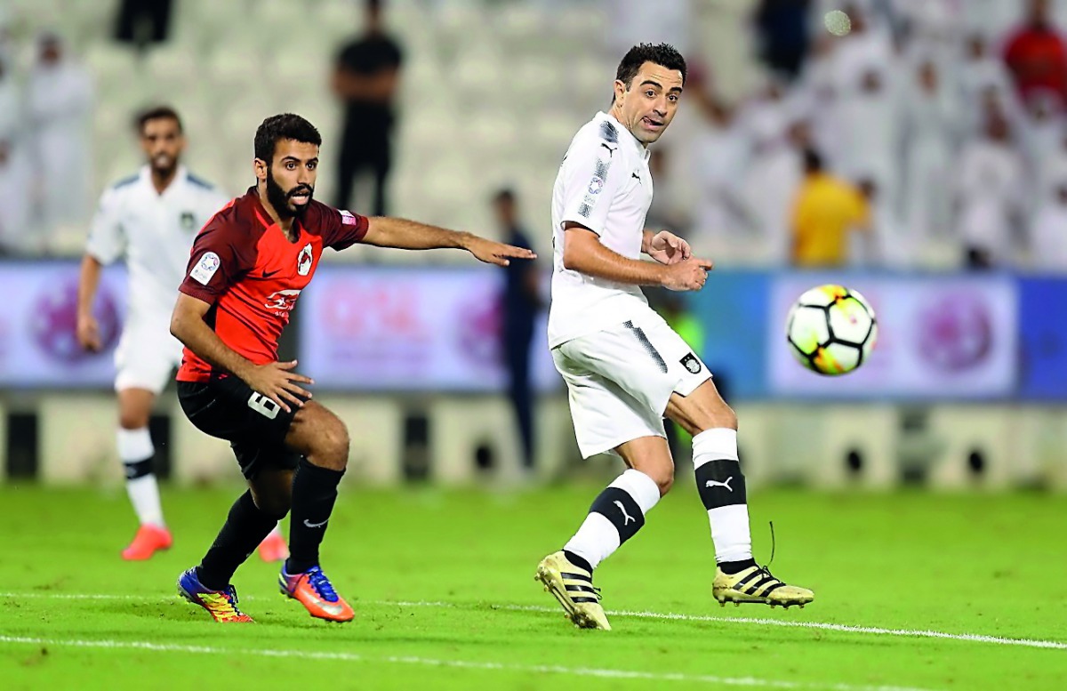 Al Sadd’s Xavi Hernandez (left) in action in this file photo