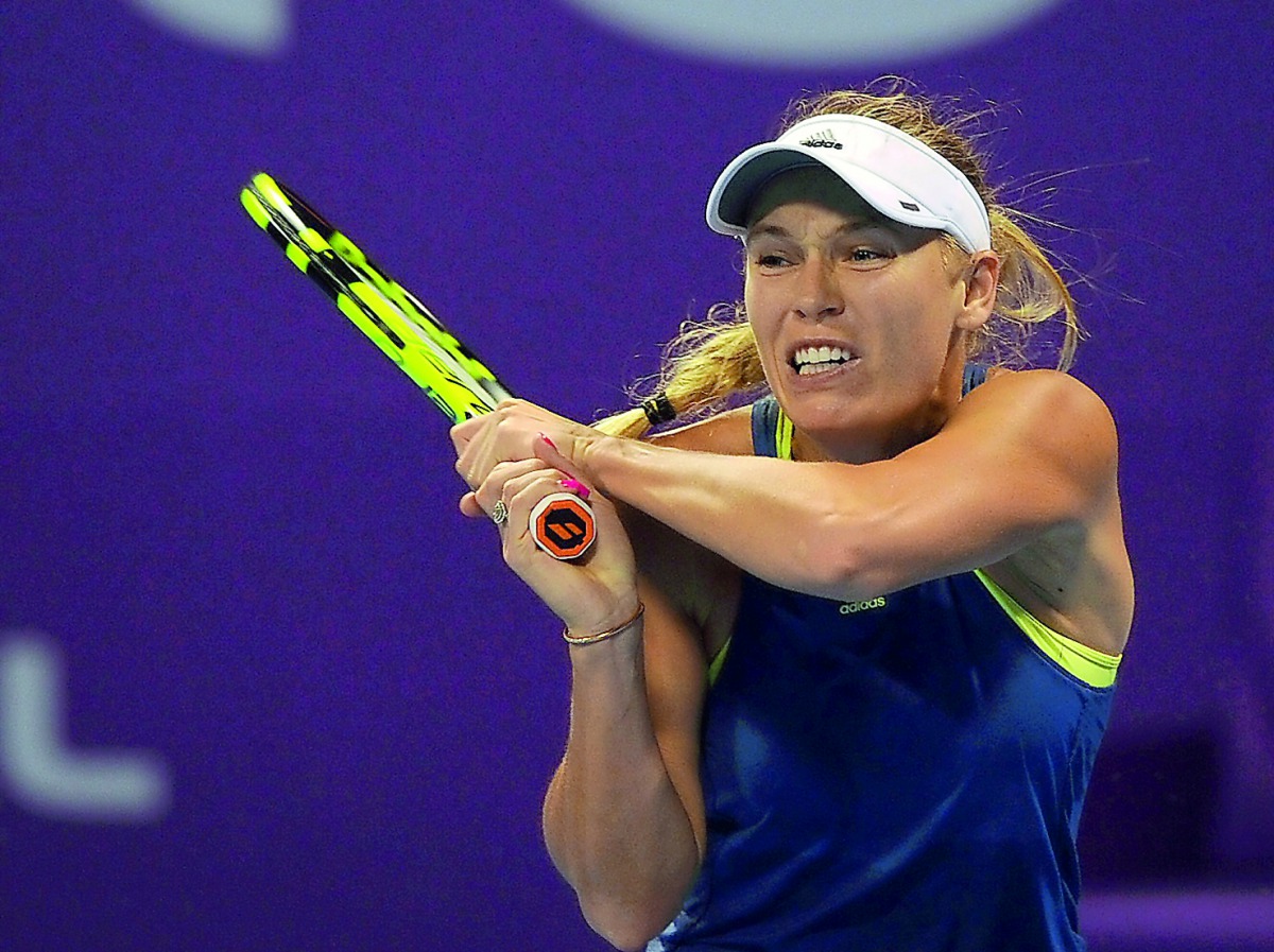 Denmark’s World number one Caroline Wozniacki returns the ball to Carina Witthoeft of Germany during their second round match of the Qatar Total Open 2018 at the Khalifa International Tennis and Squash Complex in Doha yesterday. Picture: Salim Matramkot/T