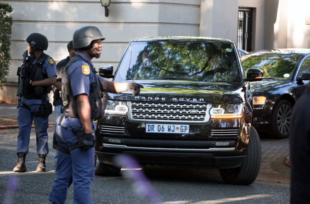 A police convoy leaves the home of the Gupta family in Johannesburg, South Africa, February 14, 2018. Reuters/James Oatway