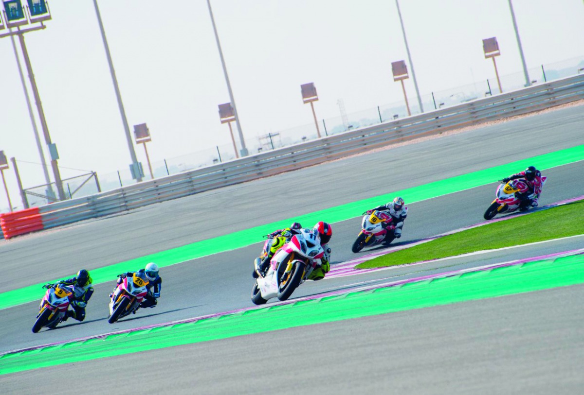 Riders in action during the Qatar Superstock 600 Superpole  at the Losail International Circuit yesterday.  INSETS: (Top left) Hamad Al Asam in action during the qualifying round of the Qatar Touring Car Championshi fourth round. (Top right) Qatari rider 