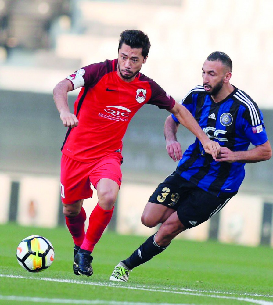 Al Rayyan’s Rodrigo Tabata (left) is challenged by a Al Sailiya player during the QNB Stars League match in Doha yesterday.