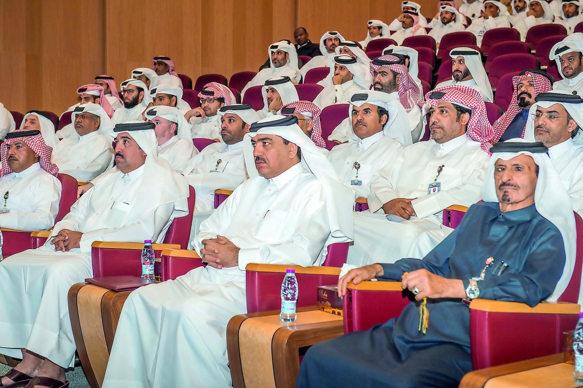 Minister of Municipality and Environment H E Mohamed bin Abdullah Al Rumaihi along with other officials watching the presentation on new Public Hygiene Law at the Ministry headquarters, yesterday.