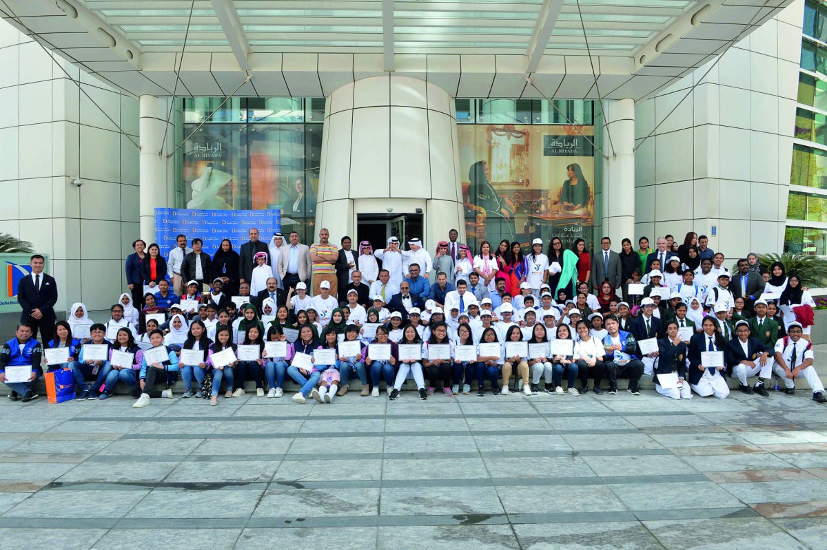 Dr R Seetharaman, CEO of Doha Bank and senior officials of the bank with students and staff members of various schools in Qatar which won the ECO-Schools Programme Awards 2018, yesterday.