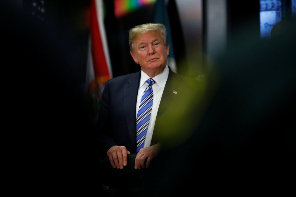 US President Donald Trump meets with law enforcement at the Broward County Sheriff's Office in the wake of the shooting at Marjory Stoneman Douglas High School in Fort Lauderdale, Florida, US, February 16, 2018. REUTERS/Eric Thayer