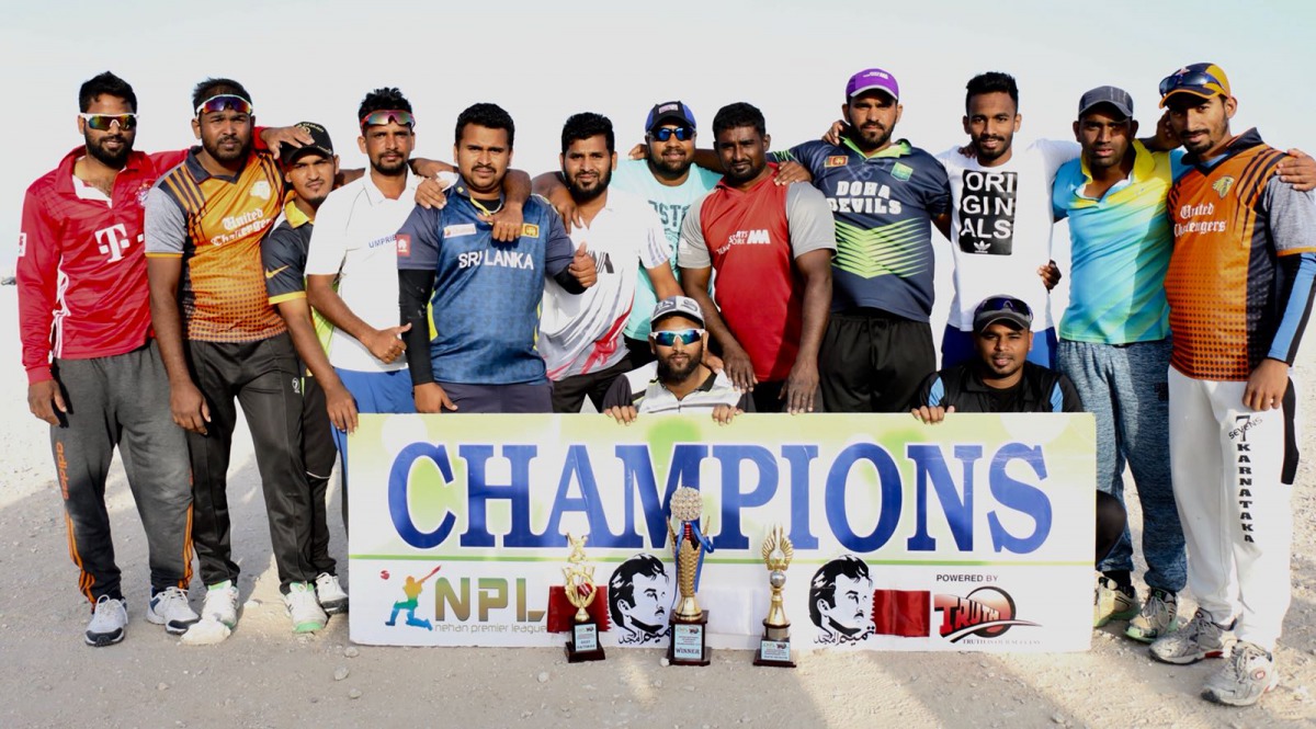 United Challengers, winners of the NPL National Sport Day cricket championship pose for a picture with the trophies.