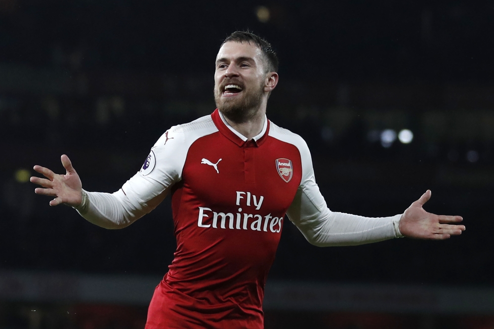 In this file photo taken on February 03, 2018 Arsenal's Welsh midfielder Aaron Ramsey celebrates scoring the team's fifth goal during the English Premier League football match between Arsenal and Everton at the Emirates Stadium in London on February 3, 20