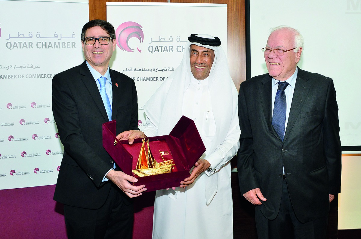 Qatar Chamber board member Ali Abdullatif Al Misnad (centre) with ASMEX President Hassan El Sentissi El Edrissi (right) and Nabi Zniber, Ambassador of Morocco to Qatar while exchanging mementos .