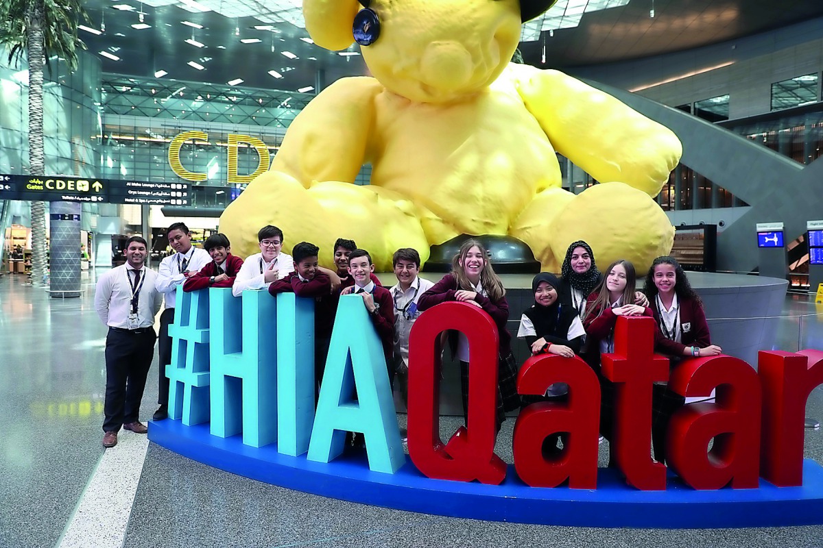 Oryx International School Group Photo with the Lamp Bear at Hamad International Airport.
