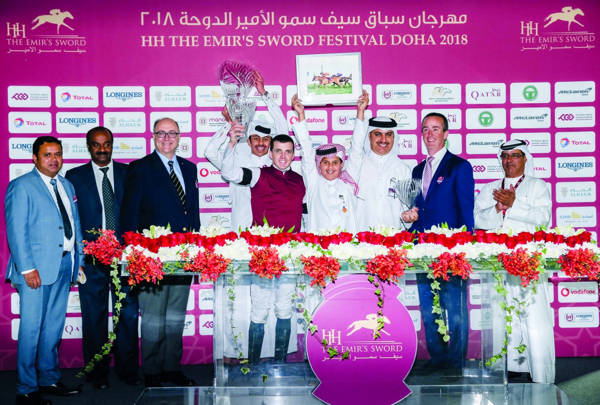 Jockey Martin Harley celebrates his win after clinching the Irish Thoroughbred Marketing Cup at the Qatar Racing and Equestrian Club in Al Rayyan yesterday. Harley guided Pleaseletmewin to victory in the 1600m race. 