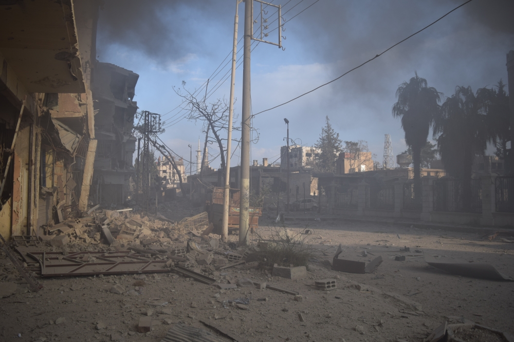The wreckage of destroyed buildings in Douma town of Eastern Ghouta in Damascus, Syria on February 24, 2018. (Mouneb Abu Taim / Anadolu)