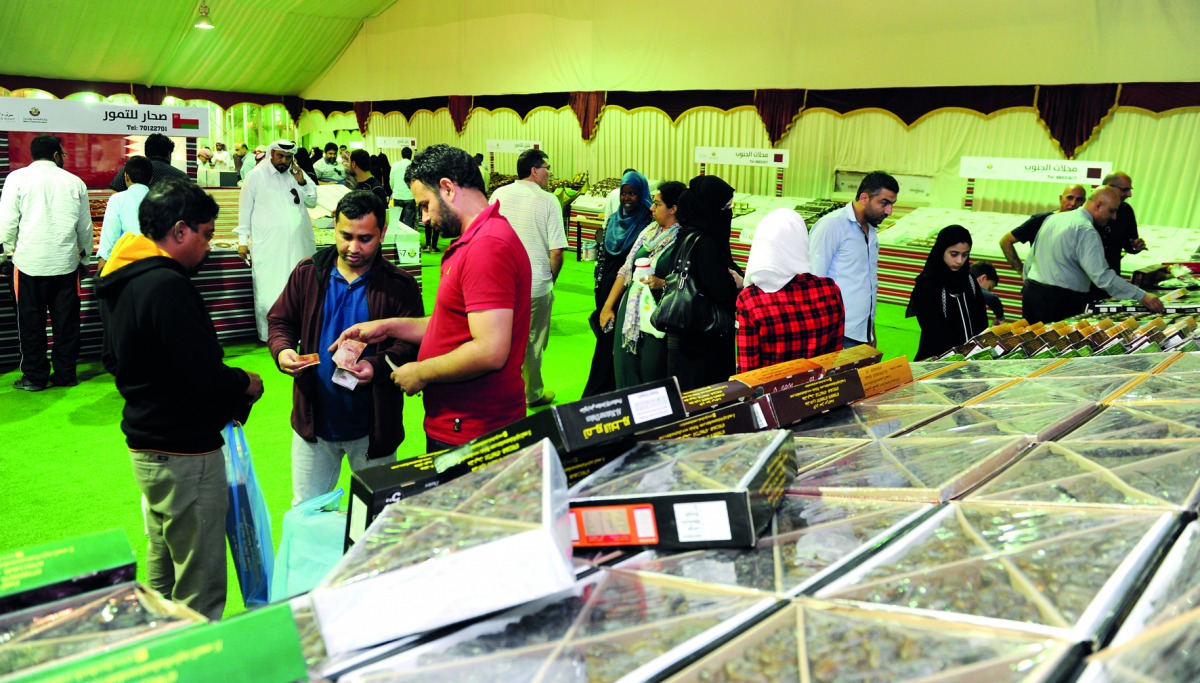 Visitors buying dates at the Seasonal Dates Market at Souq Waqif, yesterday. Pic: Salim Matramkot/The Peninsula