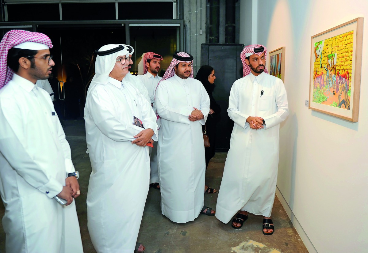 Qatari artist Abdulla Al Kuwari (right) at the opening of “Imaginary Motifs” exhibition yesterday at Fire Station. Pic: Abdul Basit / The Peninsula 