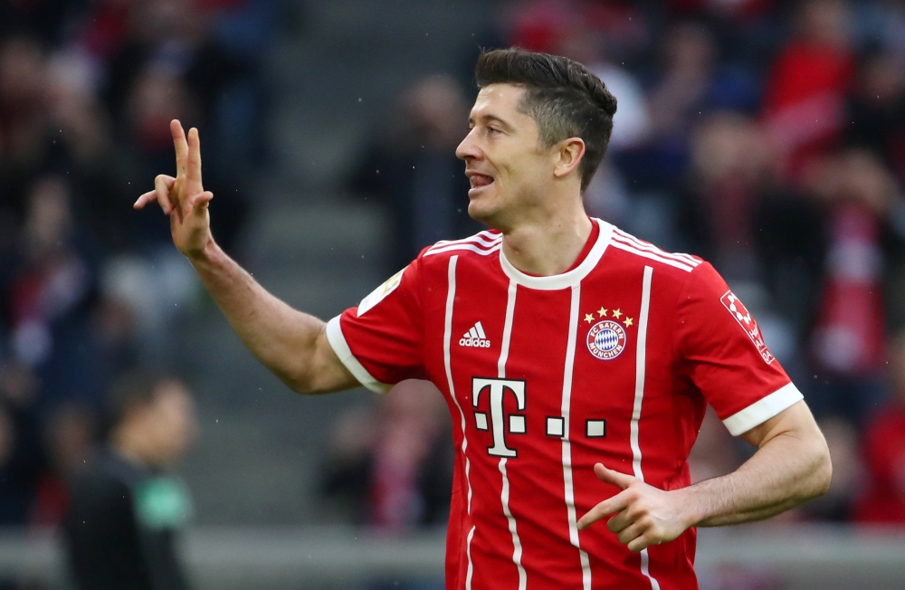 Bayern Munich's Robert Lewandowski celebrates scoring their sixth goal REUTERS/Michael Dalder 
