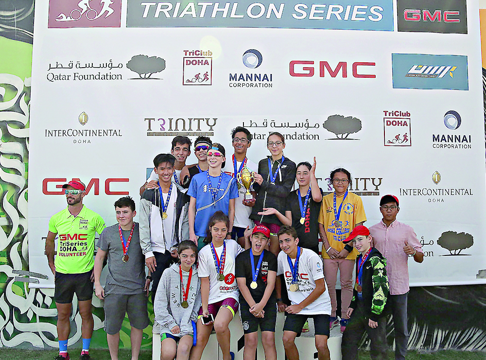 The winners of Qatar Foundation Triathlon Series pose during a photo session. 