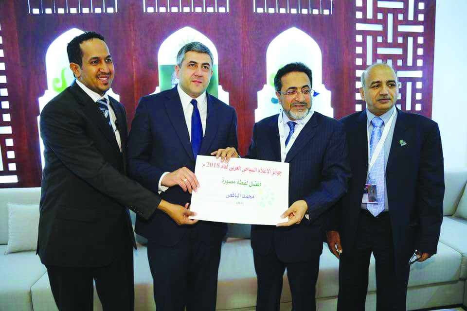 Mohammad Al Hasel Al Yafei receives the best photo award at the tenth annual Arab Tourism Media Oscar Awards.