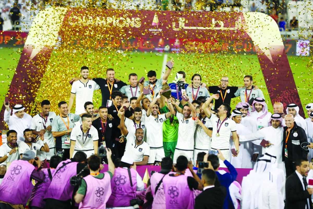 Al Sadd players and officials celebrate after winning the 2017 Qatar Cup final in Doha in this file photo. 
