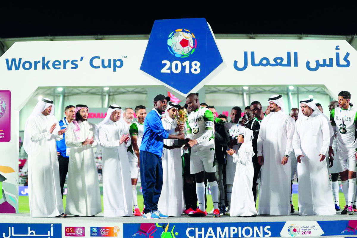 Al Nakheel Landscapes team captain receiving the 2018 Workers’ Cup Trophy during the presentation ceremony at Al Duhail Stadium, yesterday. 