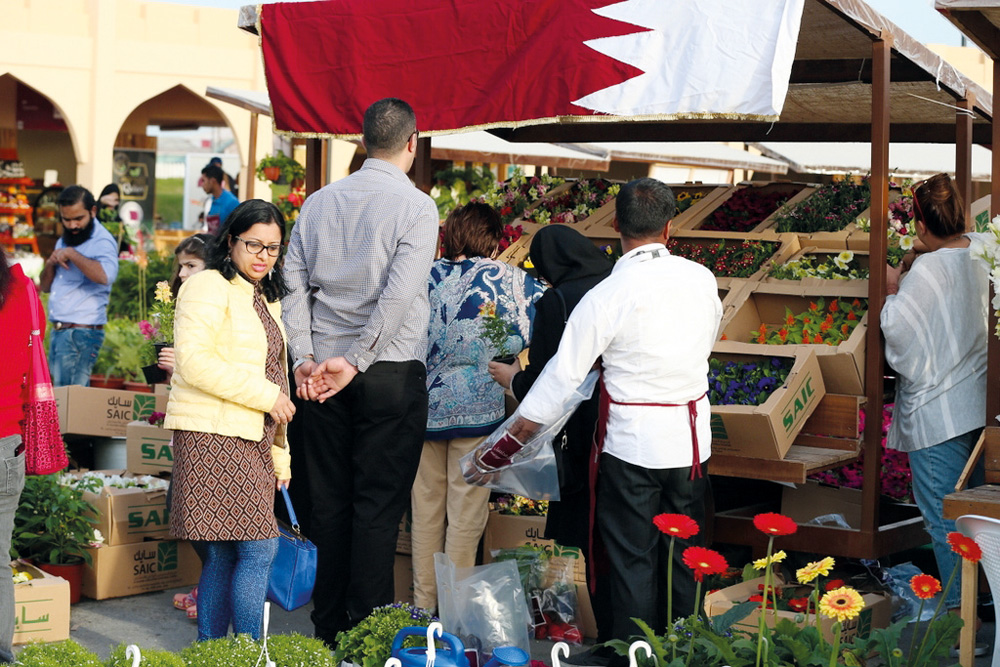 People flock a stall selling locally grown ornamental plants at Mahaseel Souq which concludes today at the Southern area of Katara. 
