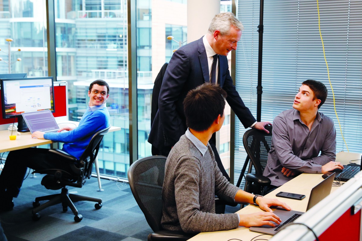 French Finance Minister Bruno Le Maire talks with employees at the Paris headquarters of U.S. networks giant Cisco Systems as part of a visit to present an annual report on foreign investment in France, in Issy-les-Moulineaux, France, April 3, 2018. Reute