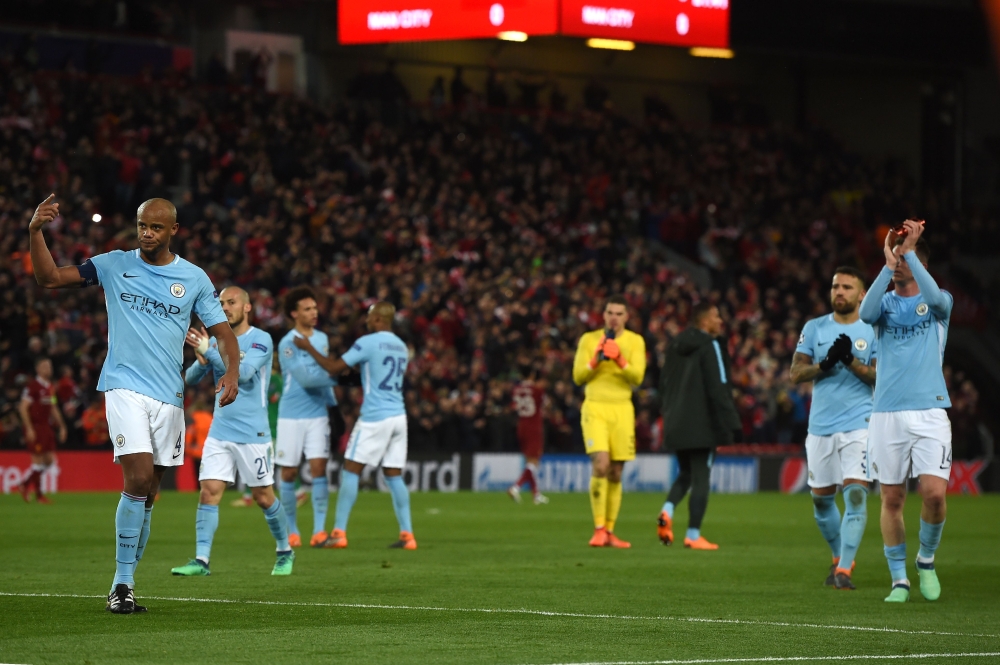 Manchester City players react at the final whistle during the UEFA Champions League first leg quarter-final football match between Liverpool and Manchester City, at Anfield stadium in Liverpool, north west England on April 4, 2018. / AFP / PAUL ELLIS