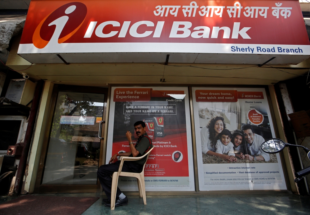 A security guard sits outside an ICICI bank branch in Mumbai, India, April 4, 2018. (REUTERS/Francis Mascarenhas)