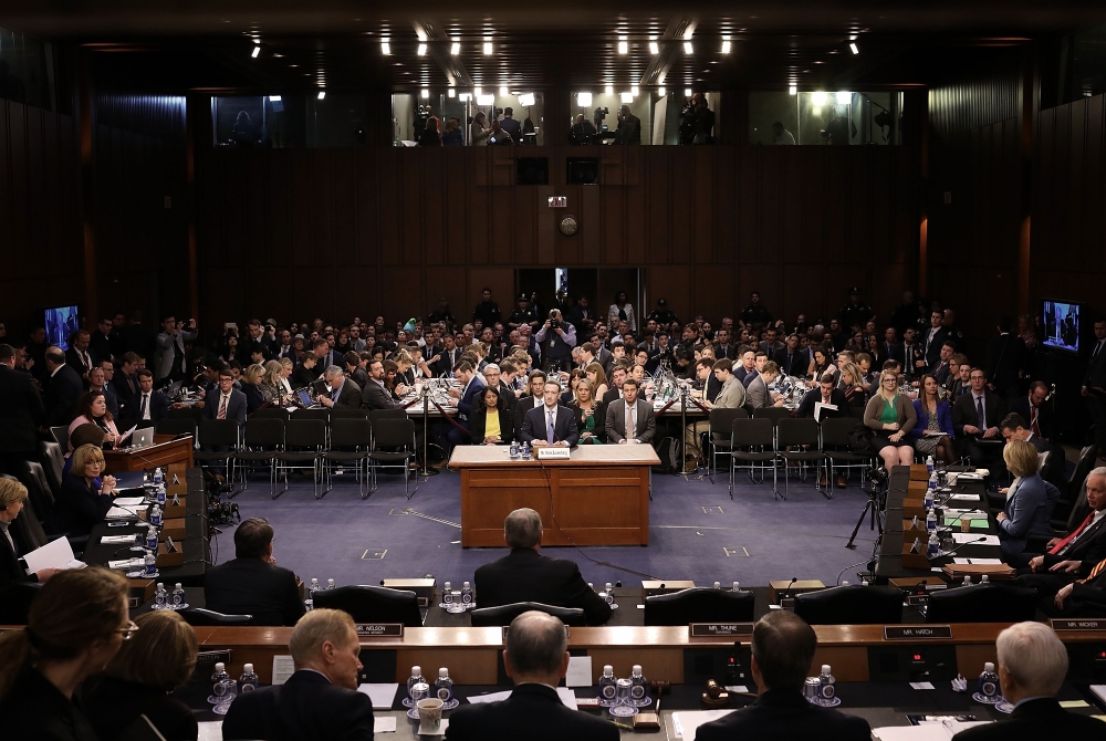 Facebook founder and CEO Mark Zuckerberg arrives to testify during a Senate Commerce, Science and Transportation Committee and Senate Judiciary Committee joint hearing about Facebook on Capitol Hill in Washington, DC, April 10, 2018. / AFP / POOL / Win Mc