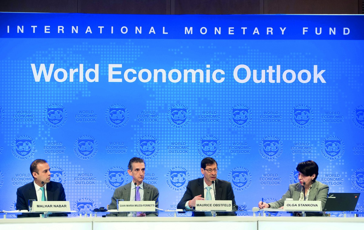 Maurice Obstfeld (2nd R), Economic Counsellor and Director of the Research Department at the IMF; Gian Maria Milesi-Ferretti (2nd ), Deputy Director of the Research Department at the IMF; Malhar Nabar (L), Deputy Division Chief of the Research Department 