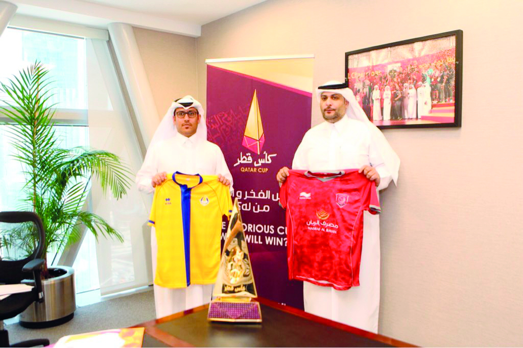 Officials of Al Gharafa and Al Duhail display the team jerseys after the Qatar Cup technical meeting yesterday.