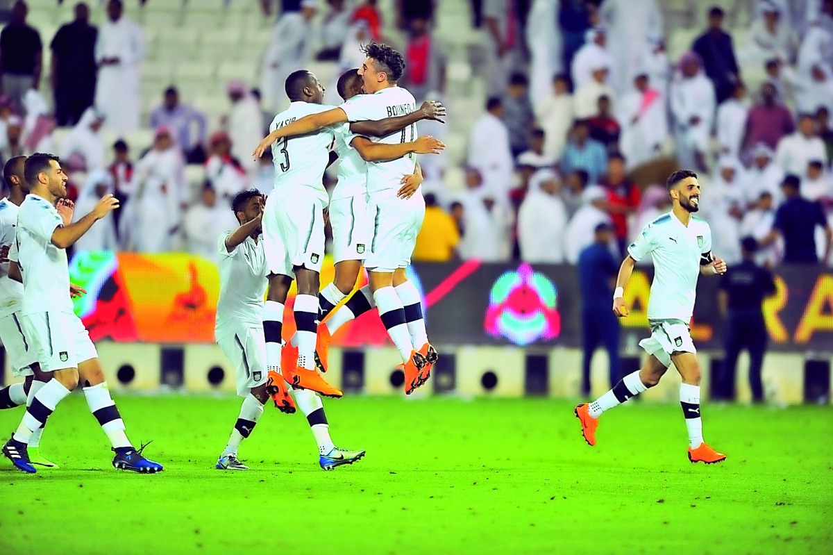 Al Sadd players celebrate their win over Al Rayyan in the Qatar Cup at Al Sadd Stadium in Doha yesterday.