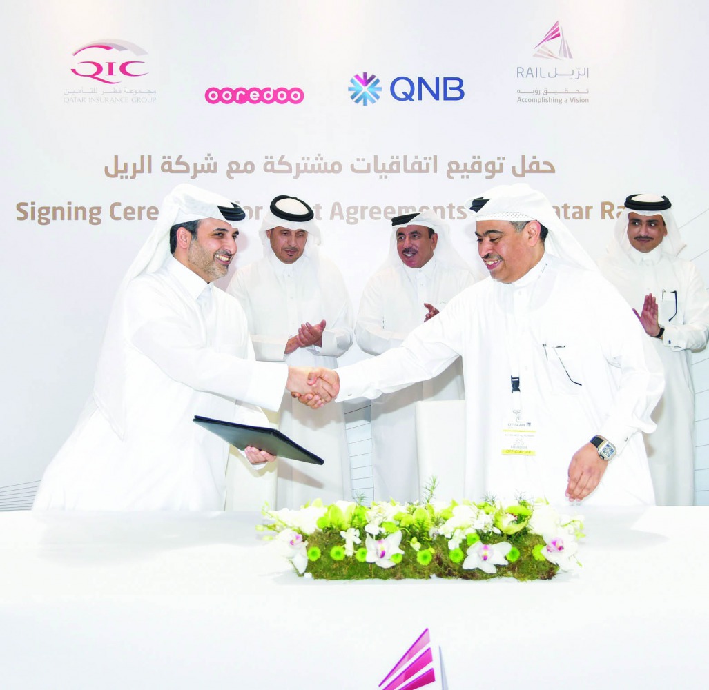 H E Sheikh Abdullah bin Nasser bin Khalifa Al Thani (second left), the Prime Minister and Interior Minister; and H E Jassim bin Saif Al Sulaiti (second right), Minister of Transport and Communications; look on as  Ali Ahmed Al Kuwari (right), QNB Group Ch