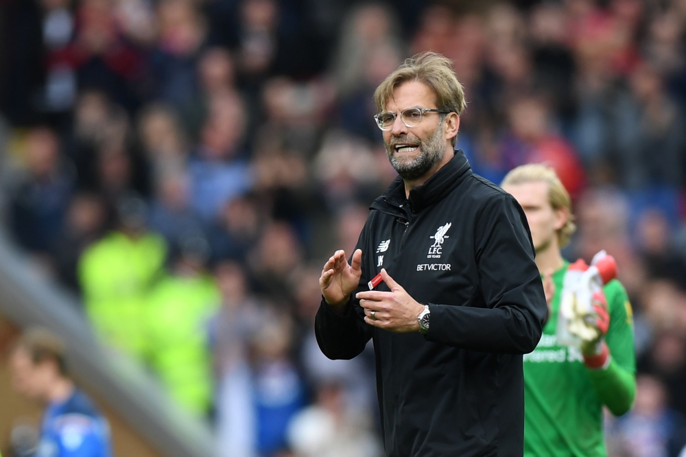 Liverpool's German manager Jurgen Klopp gestures at the final whistle during the English Premier League football match between Liverpool and Stoke City at Anfield in Liverpool, north west England on April 28, 2018.  AFP / Paul ELLIS 
