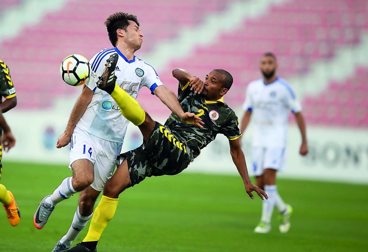 Mesaimeer’s Ahmed Kano (left) celebrates with a team-mate after scoring the winning goal against Al Sailiyah yesterday.