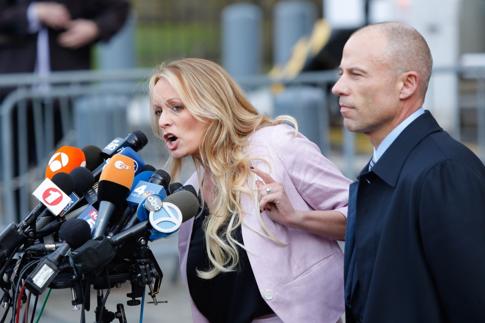 In this file photo taken on April 16, 2018 adult-film actress Stephanie Clifford, also known as Stormy Daniels speaks outside US Federal Court with her lawyer Michael Avenatti (R) in Lower Manhattan, New York.  AFP / Eduardo Munoz Alvarez