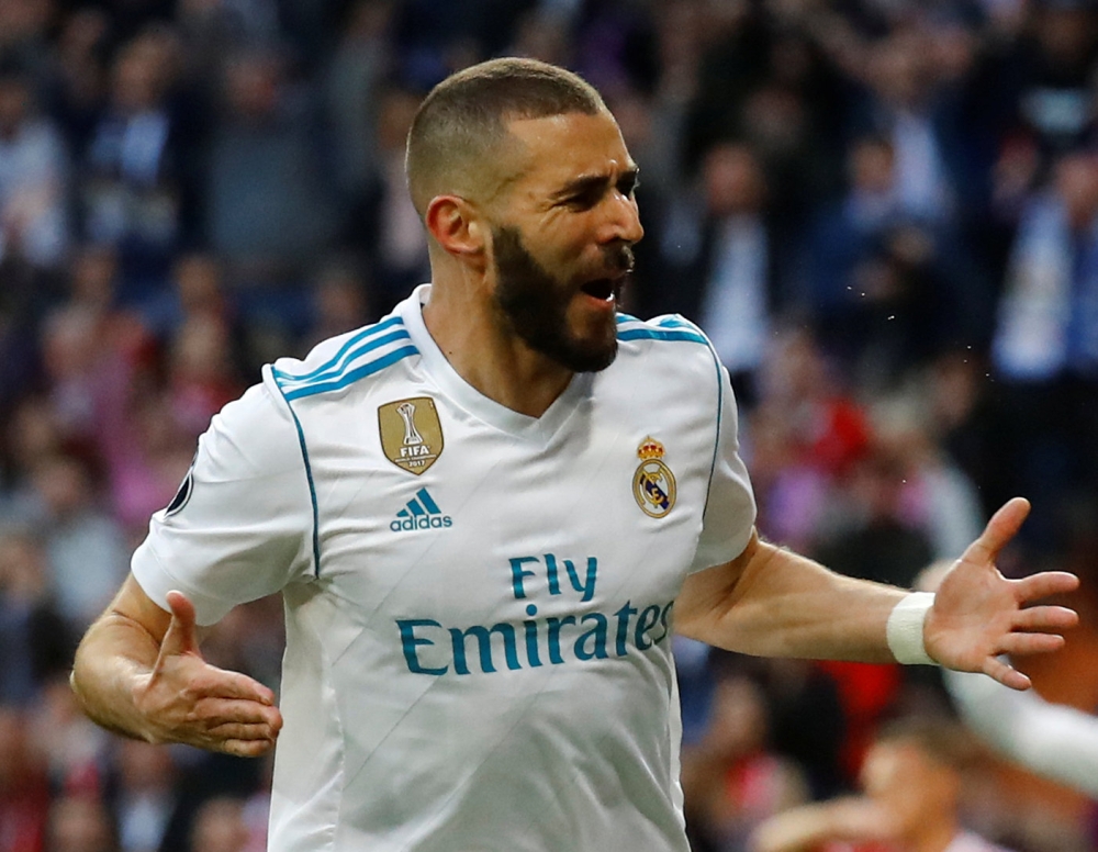 Real Madrid's Karim Benzema celebrates scoring their first goal. Reuters/Kai Pfaffenbach