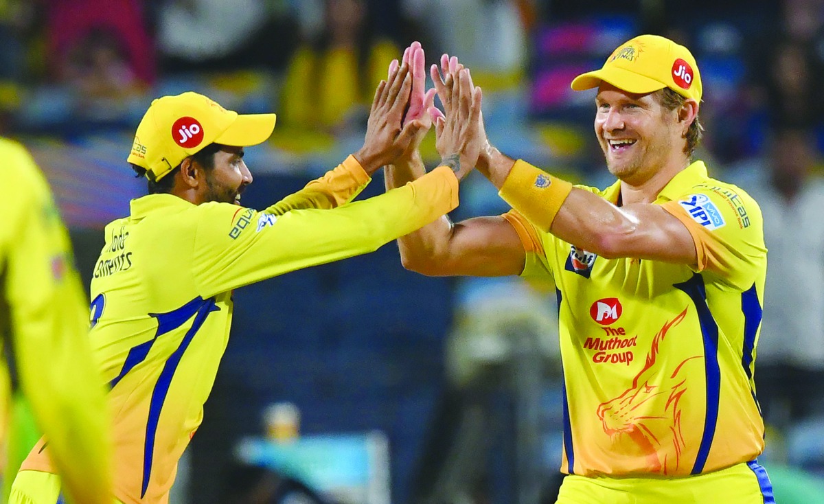 Chennai Super Kings cricketer Ravindra Jadeja congratulates teammate Shane Watson (R) after effecting the run-out of Delhi Daredevils cricketer Shreyas Iyer during the 2018 Indian Premier League (IPL) Twenty20 cricket match between Chennai Super Kings and