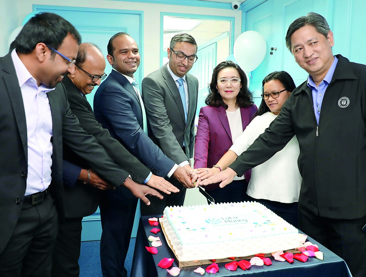 Officials cutting a cake at the inauguration ceremony.