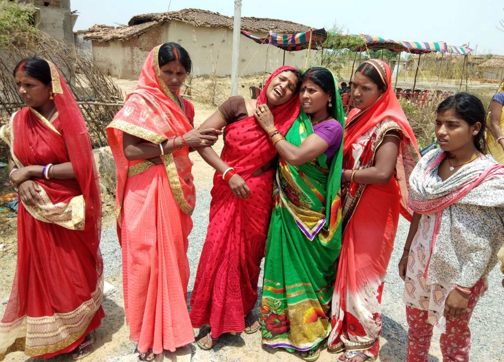 In this photograph taken on May 5, 2018, Indian relatives mourn following the rape and murder of a 16-year-old girl on May 3, at Raja Kundra Village in Chatra district of the eastern Indian state of Jharkhand. AFP