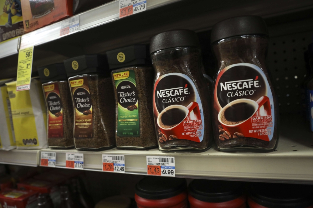 Nestle's Nescafe coffee products sit on the shelf at a CVS Pharmacy store, May 7, 2018 in New York City.  Drew Angerer/Getty Images/AFP
