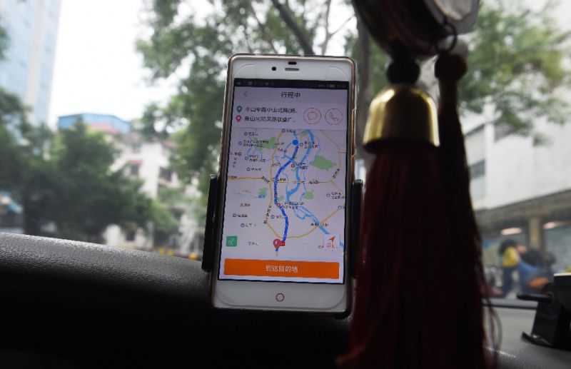 Didi Chuxing says it has 21 million drivers and more than 450 million users across its various services (AFP Photo/GREG BAKER)
