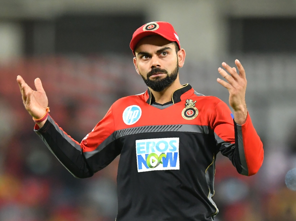 Royal Challengers Bangalore captain Virat Kohli reacts during the 2018 Indian Premier League (IPL) Twenty20 cricket match between Kings XI Punjab and Royal Challengers Bangalore at the Holkar Cricket Stadium in Indore on May 14, 2018. GETTYOUT / AFP / PUN