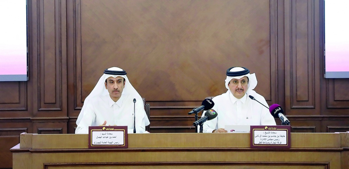 QC’s Chairman Sheikh Khalifa bin Jassem Al Thani (right) and Chairman of General Authority of Customs Ahmed bin Abdullah Al Jamal addressing a press conference at QC headquarters, yesterday.