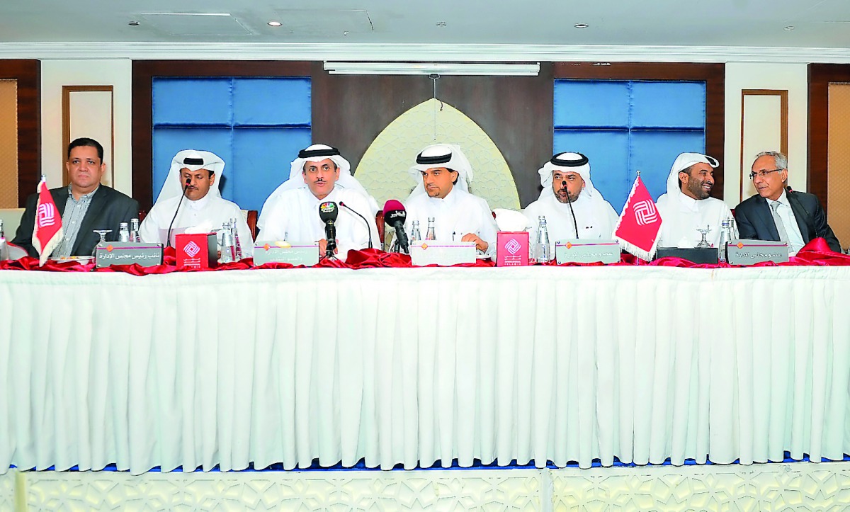 Sheikh Dr. Khalid bin Thani bin Abdullah Al Thani, QIIB Chairman and Managing Director (third left); Sheikh Abdullah bin Thani bin Abdullah Al Thani, Vice-Chairman of QIIB (second left), and Dr Abdulbasit Ahmed Al Shaibei (centre), CEO of QIIB; with other