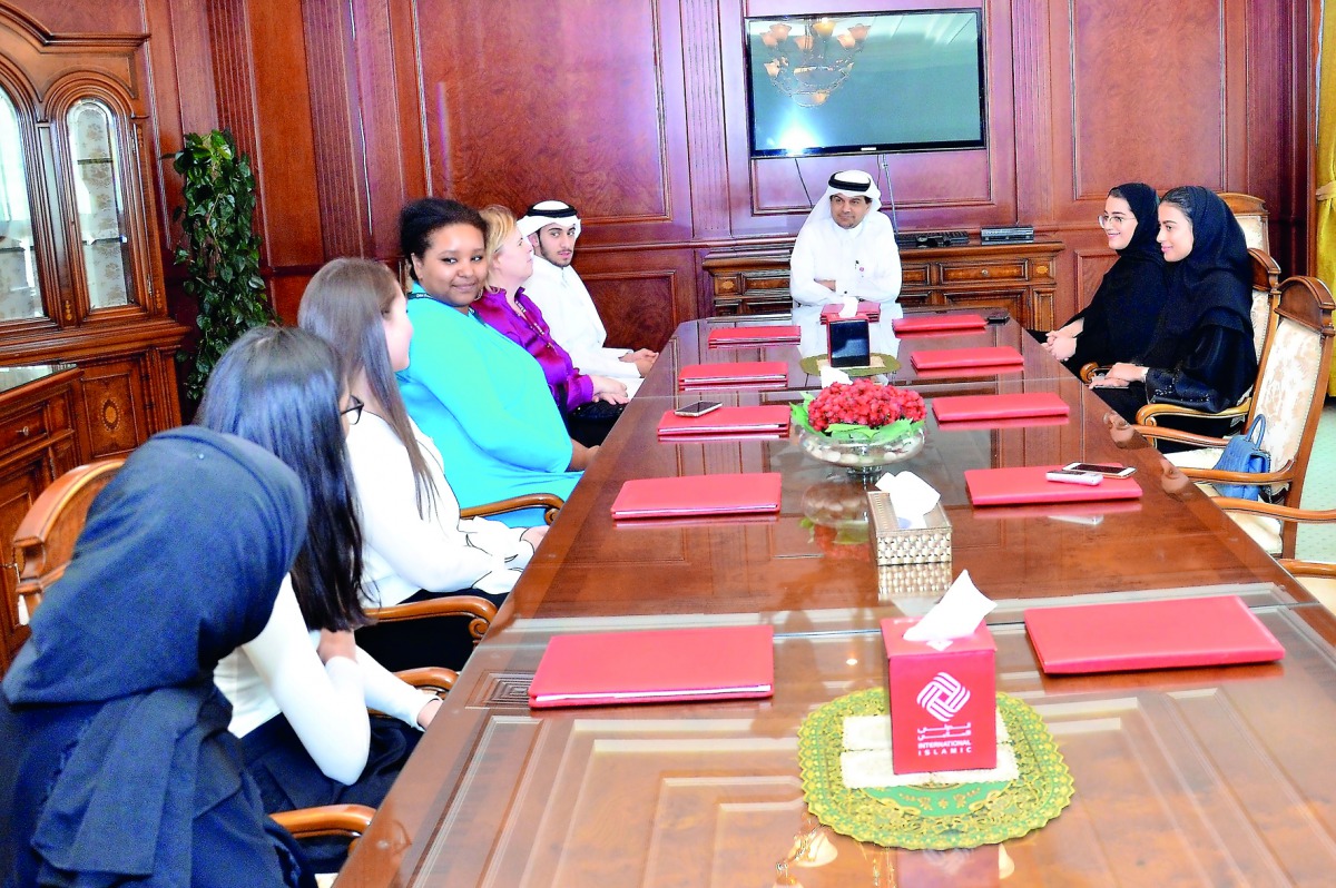 QIIB Chief Executive Officer Dr Abdulbasit Ahmad Al Shaibei (centre) with senior officials of Qatar Academy at QIIB’s headquarters.