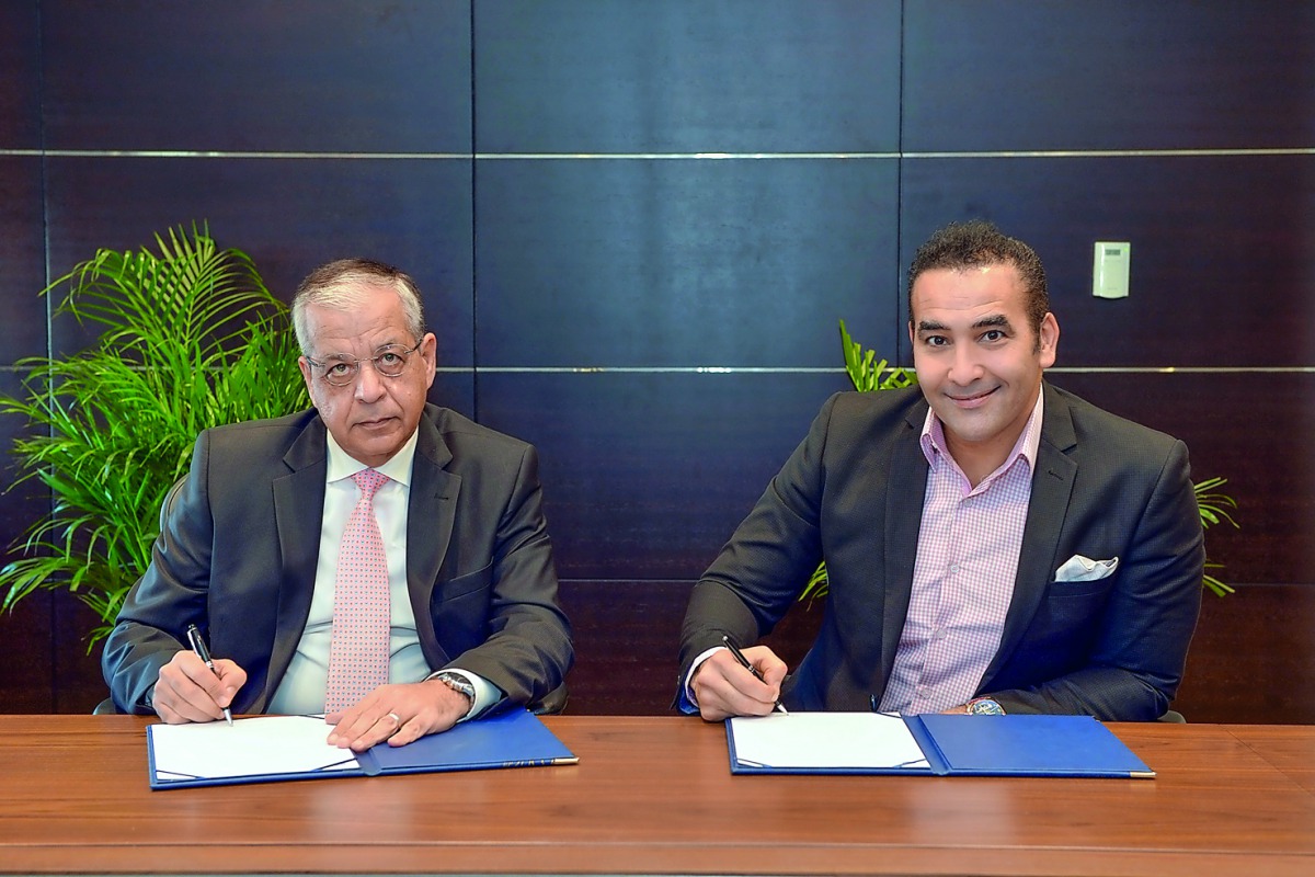 Officials of QIB and QPAY during the signing ceremony.