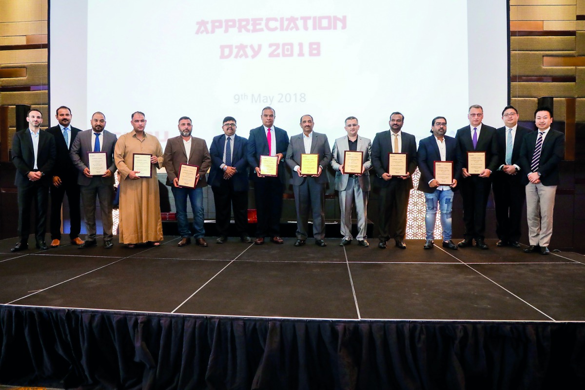 Officials of Jaidah Equipment and Isuzu posing for a group picture at the  ‘ISUZU Customers Appreciation Day 2018’ in Doha recently. 