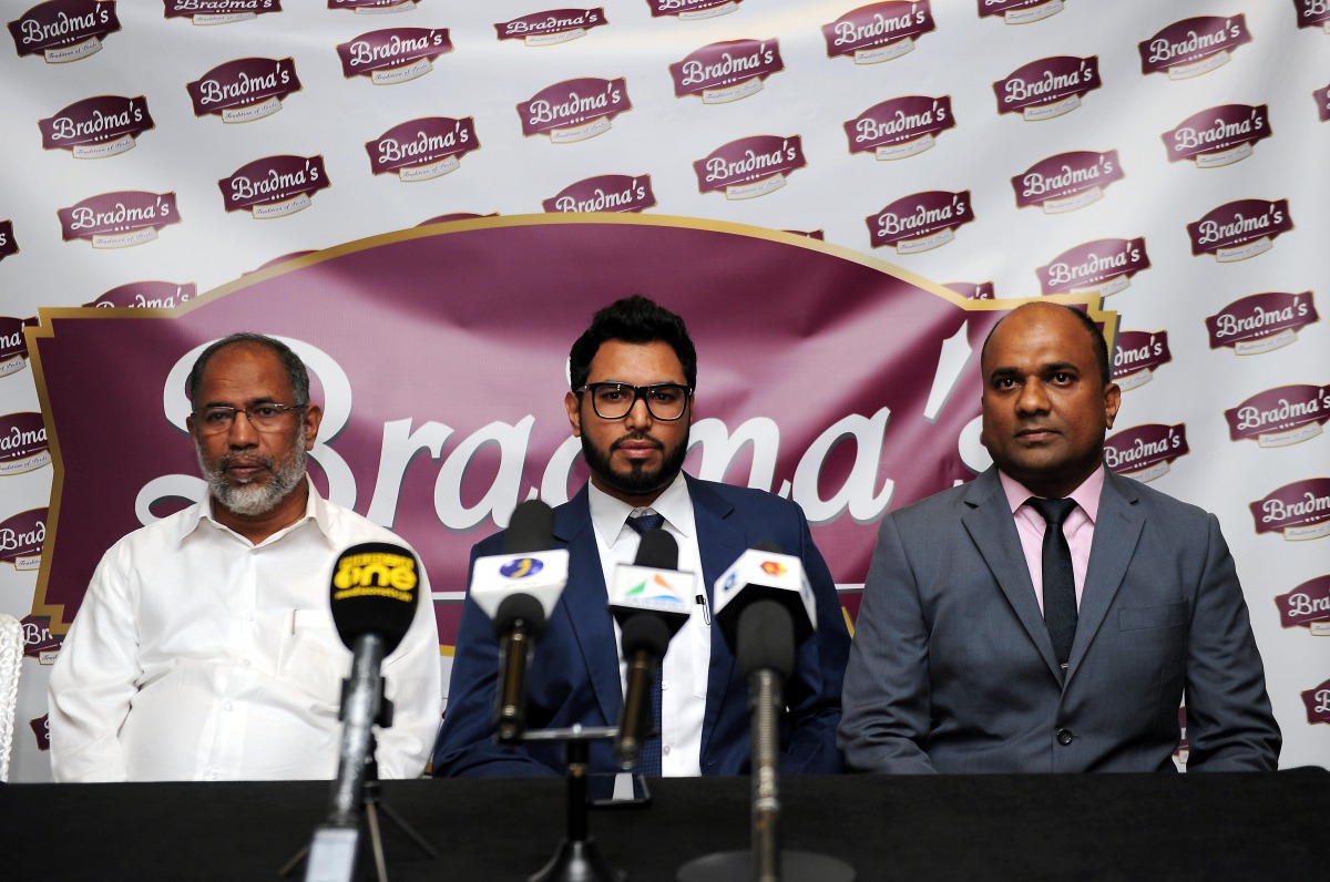 Hashim Mohamed (left), Chairman Bradma Group, with Mohammed Hafiz, (centre) Executive Director at the launch of new logo. Pic: Abdul Basit / The Peninsula