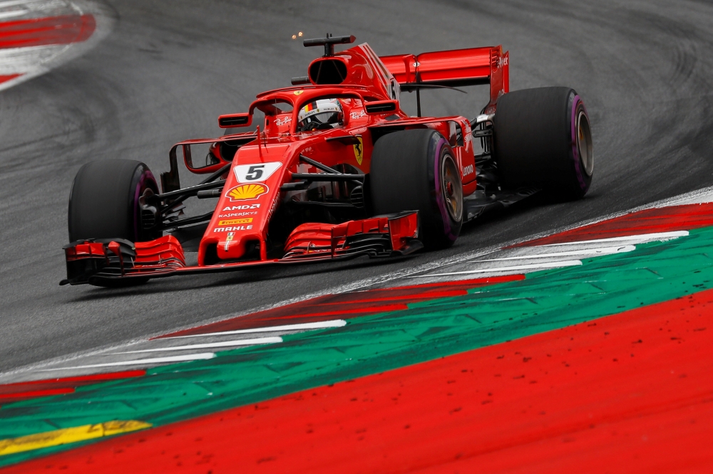 FILE PHOTO - Ferrari's Sebastian Vettel in action during qualifying REUTERS/Leonhard Foeger
