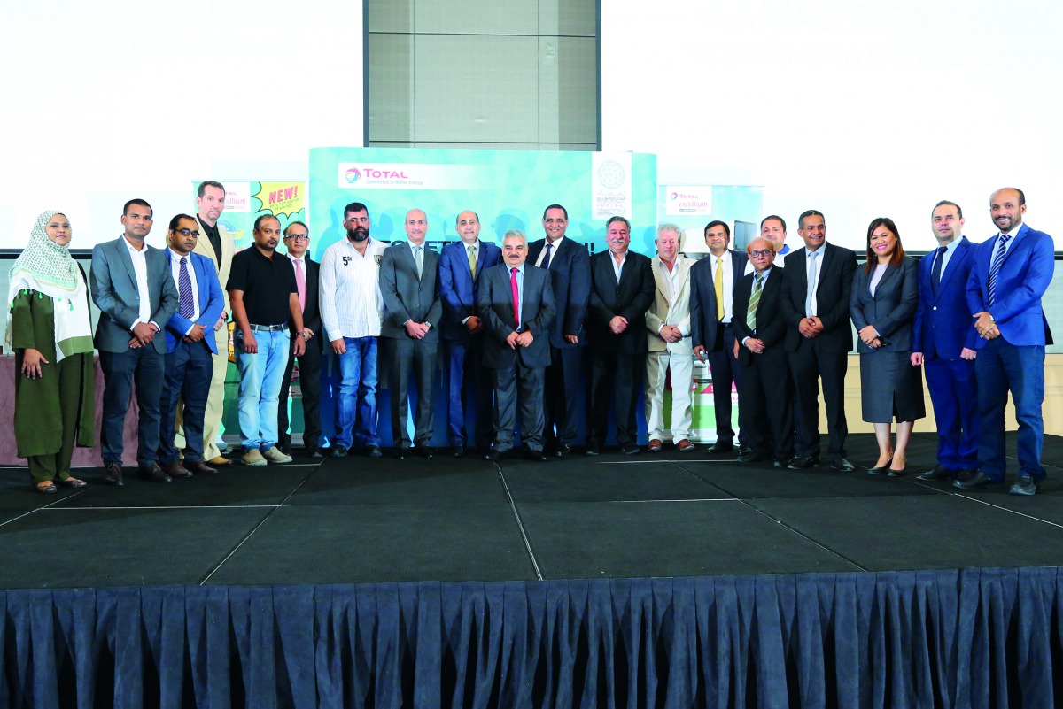 Senior officials of Aamal Trading and Contracting and TOTAL with the loyal customers at the event in Doha, recently. 